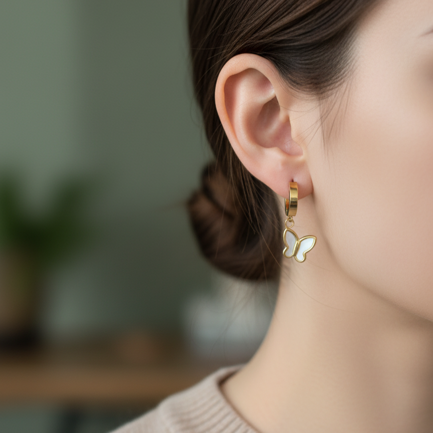 PEARL BUTTERFLY HUGGIE STUDS