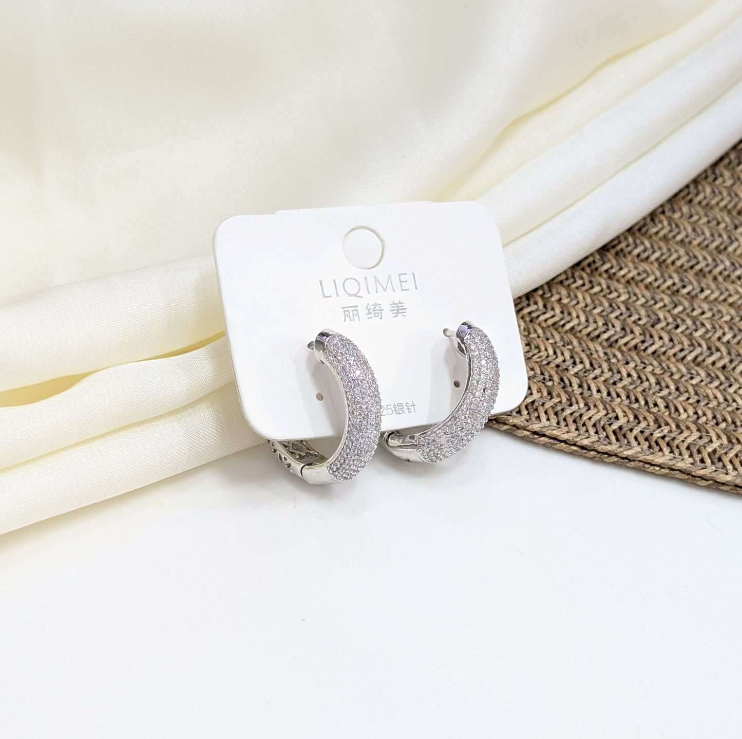SILVER PAVÉ DOME HUGGIE EARRINGS