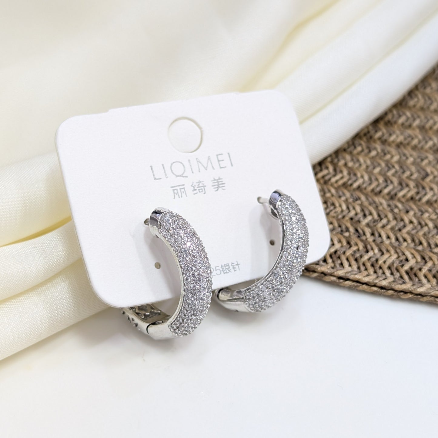 SILVER PAVÉ DOME HUGGIE EARRINGS